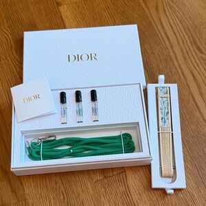 Dior Fan with lanyard and samples.